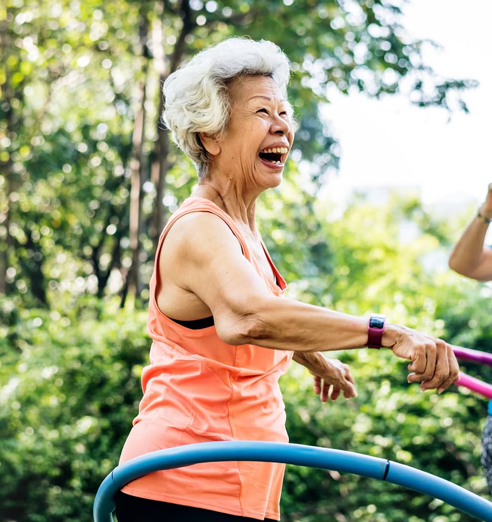 Older woman enjoying hula hooping