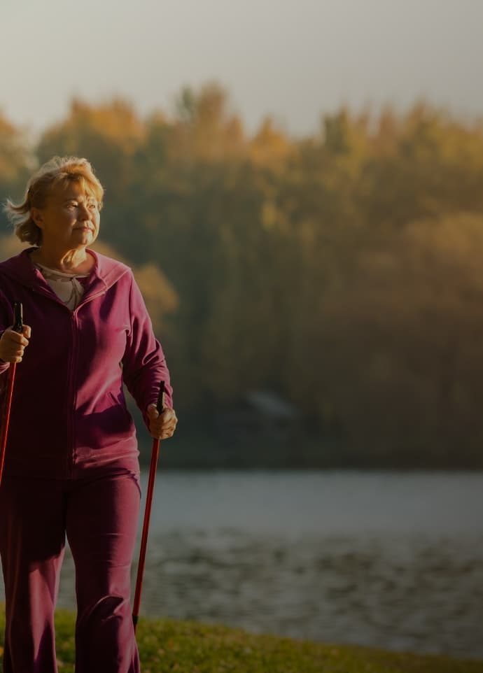 Woman walking next to the water